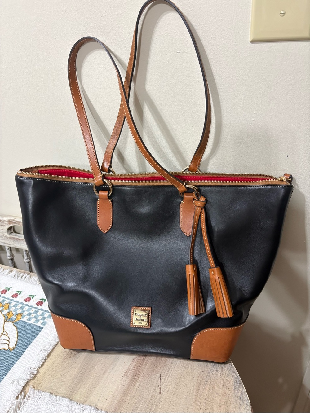 Dooney & Bourke Black Leather Tote with Brown Trim and Red Interior
